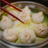 Pork Soup Shao Loong Bao · 8 pieces. Steamed dumpling, spice-infused pork, beef broth, napa cabbage, and peppercorn.