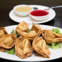House Wontons · 8 pieces. Deep-fried Chinese pastry, spice-infused ground pork, and napa challenge.
