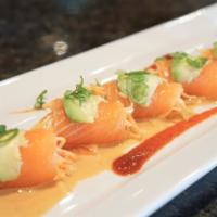 Salmon Enchilada Roll · Spicy crab meat rolled with smoked salmon; topped with avocado, green onions and miso sauce.