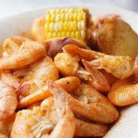 Cajun Boiled Shrimp · Boiled shrimp in cajun seasoning, served with corn on the cob and potato.