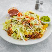Ultimate Nachos · Piled high with melted cheeses, chili, diced tomatoes, jalapeno peppers, shredded lettuce, s...