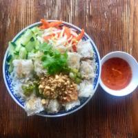 Crispy Spring Rolls Vermicelli · On vermicelli lettuce, pickled carrots and white radish, bean sprouts, fresh herbs and peanu...