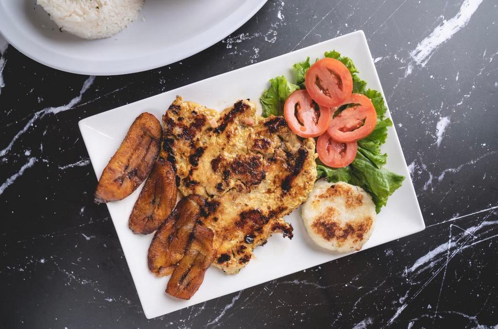 Grilled Chicken Breast  · Sweet plantain, arepa, rice and beans. 