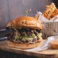 Arepalicious Burger  · 8oz Angus Beef, Skirt Steak, Guacamole, Mozzarella Cheese, and house sauce
Include fries 