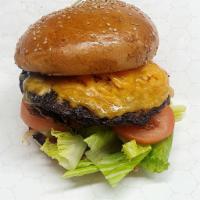 American Burger · 8oz angus Beef, cheddar cheese, tomatoes and lettuce
Include fries