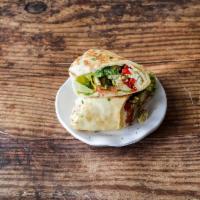 Chicken Pesto · Our Chicken Pesto Pita comes with Romaine, Roasted Red Peppers, Tomatoes, Onions, Feta Chees...