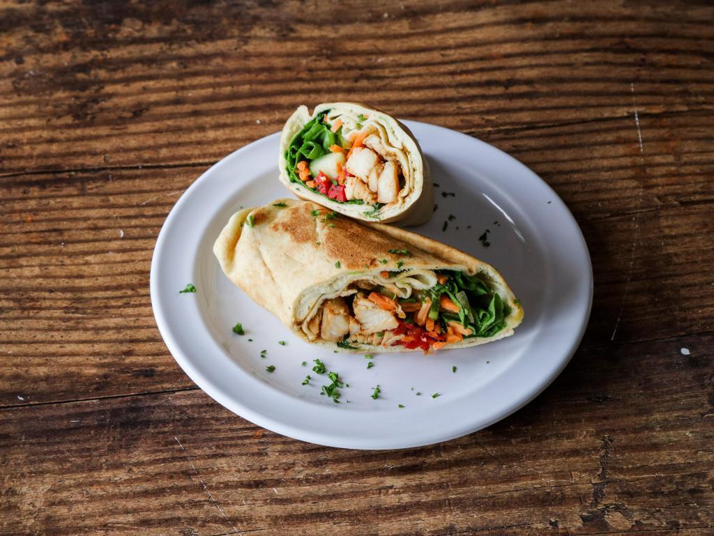 Thai Chicken · Our Thai Chicken Pita comes with Chicken grilled in Thai Satay Sauce, Spinach, Cilantro, Cucumbers, Carrots, Green Peppers, Roasted Red Peppers, Sriracha, and Mojito Lime Seasoning!