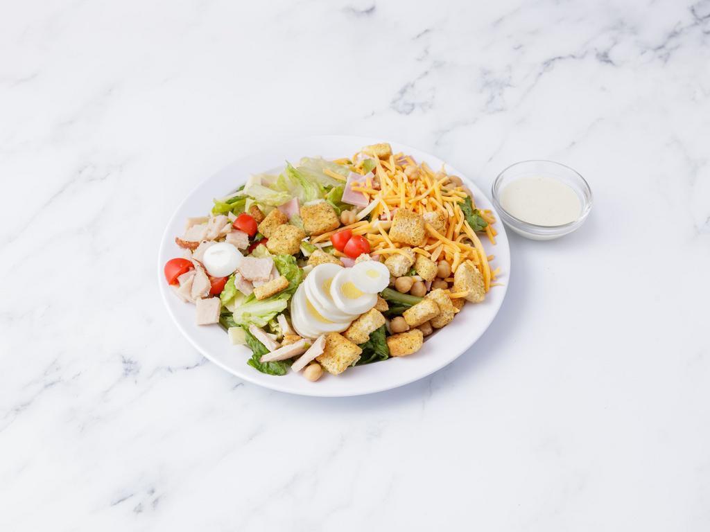 Chef Salad · Classic lettuce, ham, turkey, provolone, cheddar, Swiss cheese, cherry tomatoes, garbanzo beansm sliced hard - boiled egg and croutons