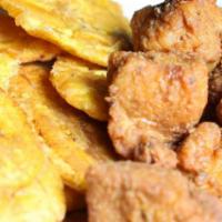 Chicharrones de Pollo · Boneless pieces of fried chicken Caribbean style with tostones.