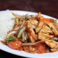 Pollo Saltado · Strips of chicken breast sauteed with cilantro, tomatoes & onions served over a bed of fries