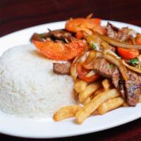Lomo Saltado · Sliced beef sauteed with onions, tomatoes, and cilantro with rice and fries.