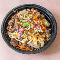 Turkey Eggroll Bowl · Lean ground turkey seasoned with sesame oil served over rice, topped with carrots, mixed cab...