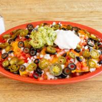 Super Nachos · Chips, cheese, beef or chicken, beans, tomato, onion, jalapenos, olives, sour cream and guac...