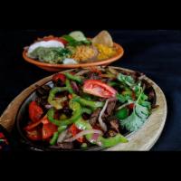 Sizzlin' Cancun Fajitas Platter · Fajitas sauteed with onions, red, yellow and green bell peppers and seasoned to perfection. ...