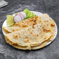 6. Corn Quesadillas · 2 pieces. Served with your choice of meat.
