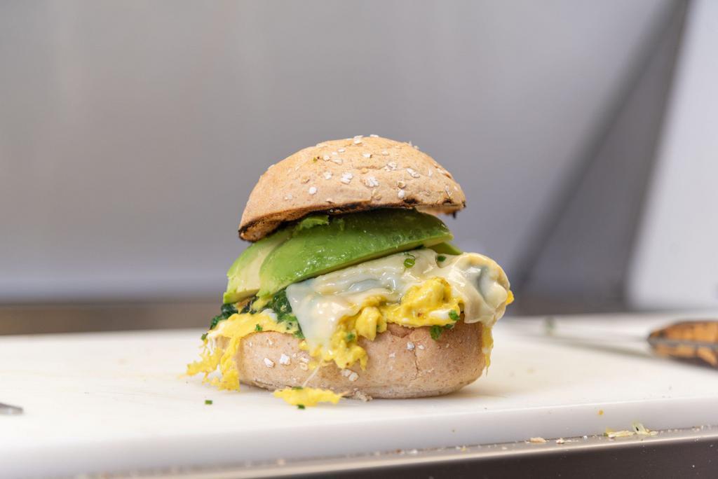 Greens and Egg Sandwich · Spinach, avocado, scrambled egg and American cheese. 