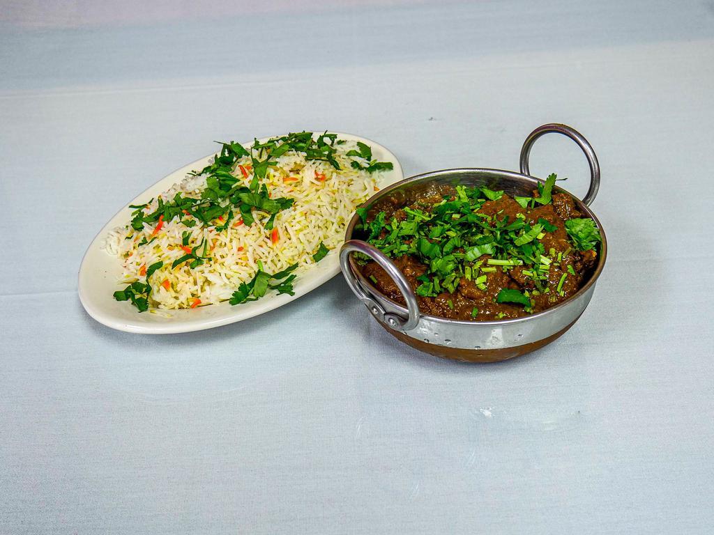 Goat Curry with Bone · Fresh goat meat cooked with onions, fresh ginger, garlic and spices.
