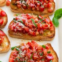 BRUSCHETTA  · Toasted garlic bread topped with basil, tomatoes, olive oil and Romano. Vegetarian.