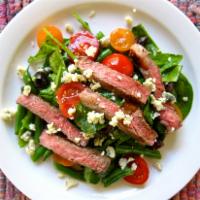Steak Salad · Romaine lettuce, grilled steak, tomatoes, Gorgonzola, house-made balsamic vinaigrette. Glute...