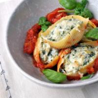 SPINACH STUFFED SHELLS · Fresh pasta stuffed with ricotta and spinach baked in our marinara sauce.