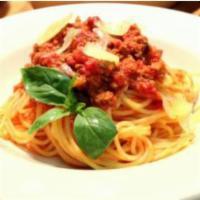 SPAGHETTI BOLOGNESE · Our beef bolognese sauce over spaghetti. Served with Parmesan and fresh herbs.