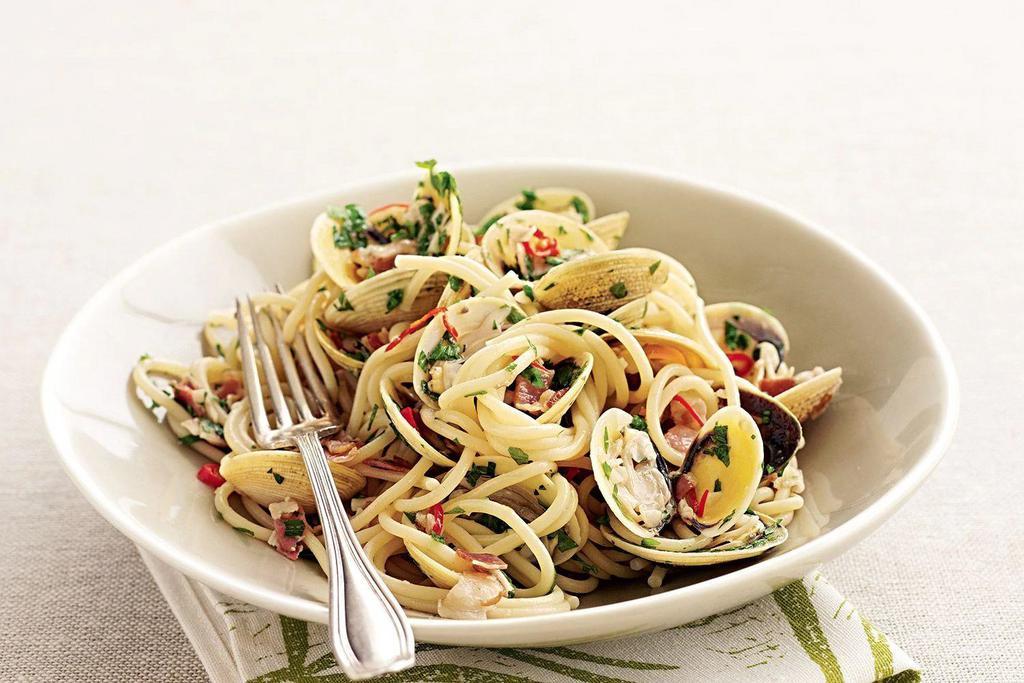 Spaghetti with Clams · Fresh clams steamed open, sauteed with fresh herbs, olive oil and garlic.