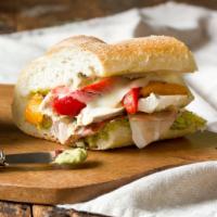 Toscano Sandwich · Grilled chicken breast, roasted peppers, provolone and basil pesto.