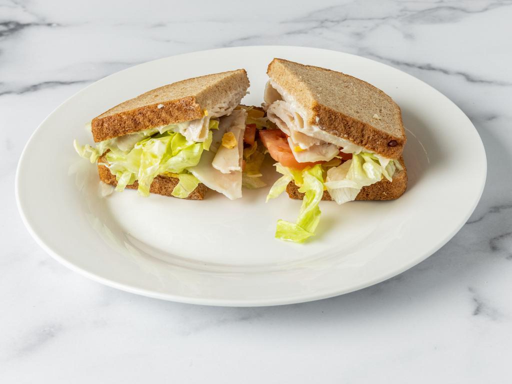 Club Sandwich · Ham, turkey on triple-decker, lettuce, and tomato regular toasted bread.