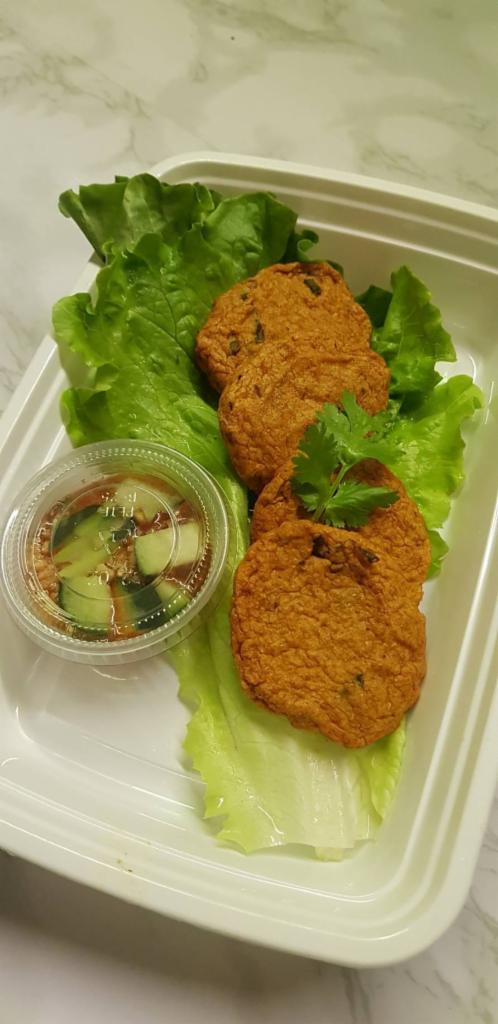 Tod Mun pla · Thai spicy fish cake served with sweet chili, cucumber and grounded peanut