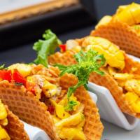 Waffle Chic Tacos · 2 tacos (freshly made waffle) Served with Ackee and Saltfish. 