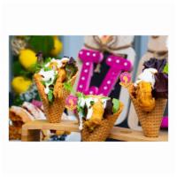 Waffle Cones · Freshly made waffle cones stuffed with shrimp or chicken and vegetable medley with choice of...