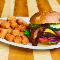 Bacon Cheddar Burger · The classic combo made better with our house made bacon! Our blend of brisket, chuck, and wa...