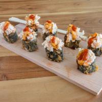 Volcano Roll · Imitation crabmeat on top of a deep-fried tuna roll, topped with spicy mayo and Sriracha sau...