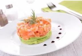 Spicy salmon tartar · spicy salmon on top of avocado with caviar and yuzu sauce
