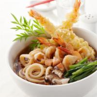 Shrimp and Vegetable Tempura Udon Noodle · Vegetabe udon soup with shrimp and vegetable tempura on the side.
