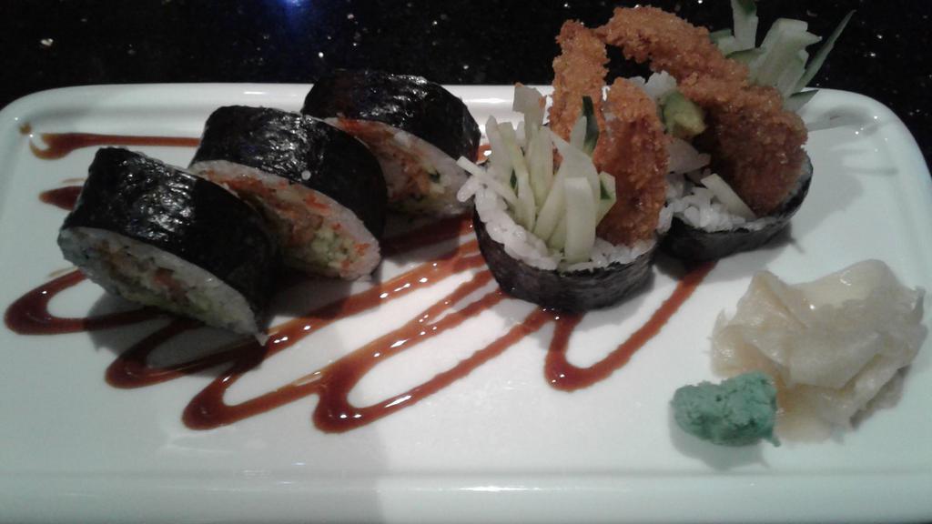 Spider Roll · Soft shell crab tempura, avocado,cucumber with eel sauce on top.