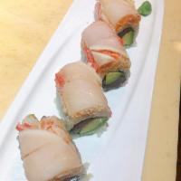 Volcano Roll · Tuna, avocado inside top with white tuna and spicy crunch crabmeat.