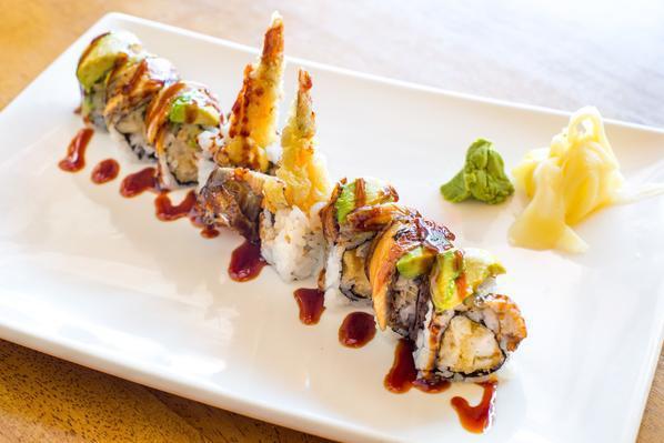 Dancing Dragon Roll · Shrimp tempura and cucumber roll with eel and avocado on top and eel sauce.
