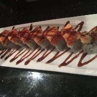 Dynamite Roll · Shrimp tempura, spicy tuna, avocado inside and topped with spicy kani.
