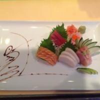 Sashimi Platter · 15 pieces assorted raw fish served with side of white rice.