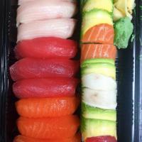 Tri-Color Sushi · 3 pieces tuna, 3 pieces salmon, 3 pieces yellowtail sushi
 with a rainbow roll.