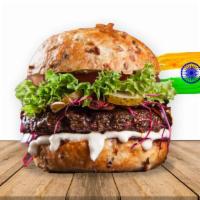 Indian Burger · Vegan patty, ketchup, house dressing, tomatoes, onion, jalapenos, cabbage, lettuce, shoestri...