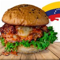 Venezuelan Burger · Angus beef, queso de mano, ketchup, onion house dressing, tomatoes, shoestring, cabbage, let...
