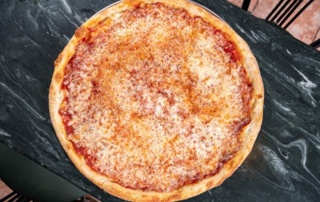 Neapolitan Pie · True Italian-style pizza with fresh mozzarella, tomatoes, and an elastic crust.