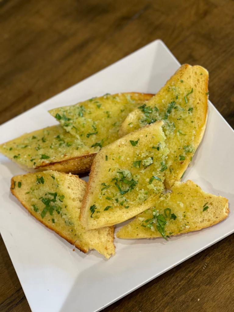 Garlic Bread · Freshly baked toasted bread with delicious garlic