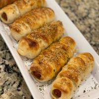 Hot Dog Roll  · NY hotdog rolled with American cheese and baked to perfection 