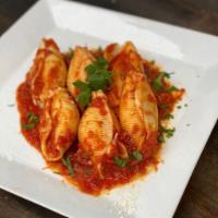 Stuffed Shells · Large shells stuffed with cheese in our delicious tomato sauce