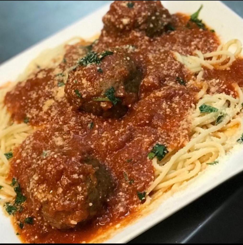 Spaghetti and Meatballs · Massive meaty ground beef meatballs with spaghetti pasta in our delicious tomato sauce 