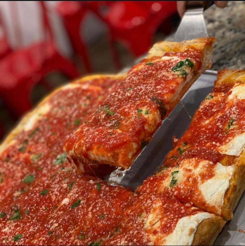 Upside Down Pie (Square)  · POPULAR
An upside down sicilian pizza 
Fresh mozzarella Cheese covered in our delicious margarita sauce