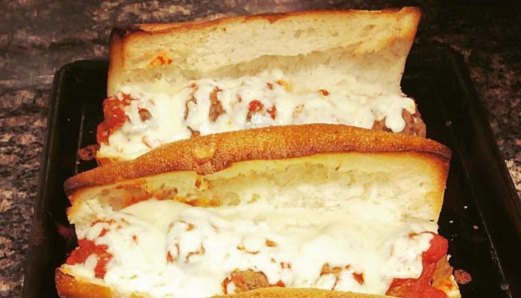 Meatball Parmigiana Sandwich · Our signature  Meatballs covered in mozzarella cheese and delicious tomato sauce, toasted to perfection in our delicious bread hero